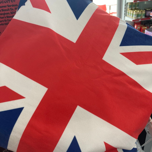 Cushion with cushion cover on adorned with the union jack flag in red, white and blue 45cm x 45cm